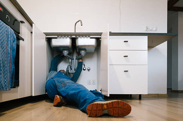 Professional Plumbing technician working in Fostoria, IA